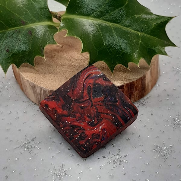 Square festive brooch in glittery red and black
