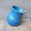 Salt pig or cellar hand thrown pottery with a wooden teaspoon 