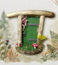 Handcrafted driftwood fairy door.