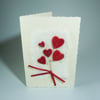 Handmade Valentine's Card. Heart flower bouquet with silver heart bead.