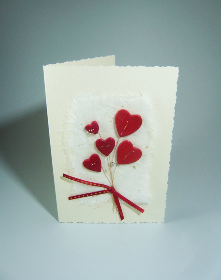 Handmade Valentine's Card. Heart flower bouquet with silver heart bead.