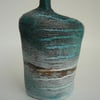 Tracks Bottle Slip Decorated onto Stoneware Ceramic