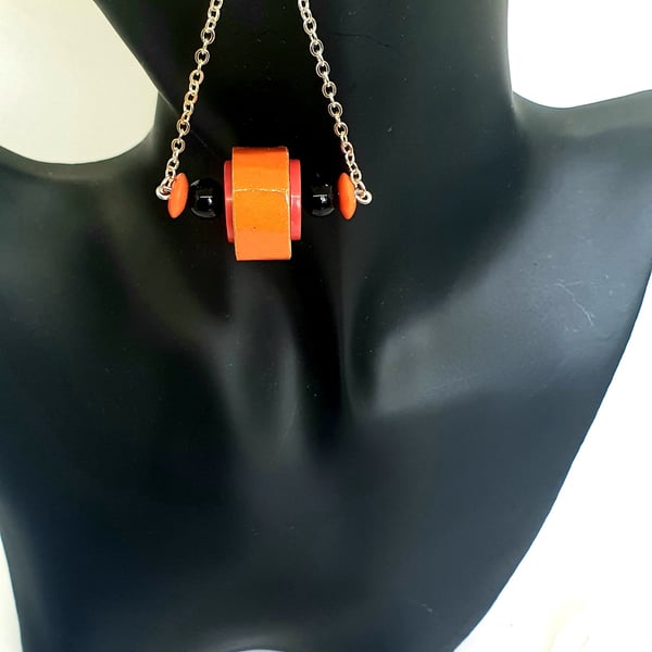Vibrant dangling orange paper beaded earrings 