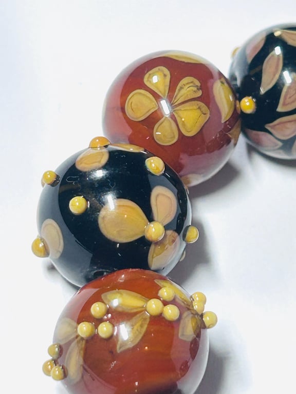 Handmade brown and amber lamp work glass beads