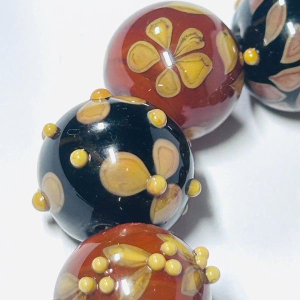Handmade brown and amber lamp work glass beads