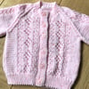 Hand knitted girl's baby cardigan to fit up to 12 months