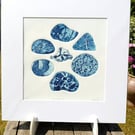 A collagraph print of beach pebbles blue