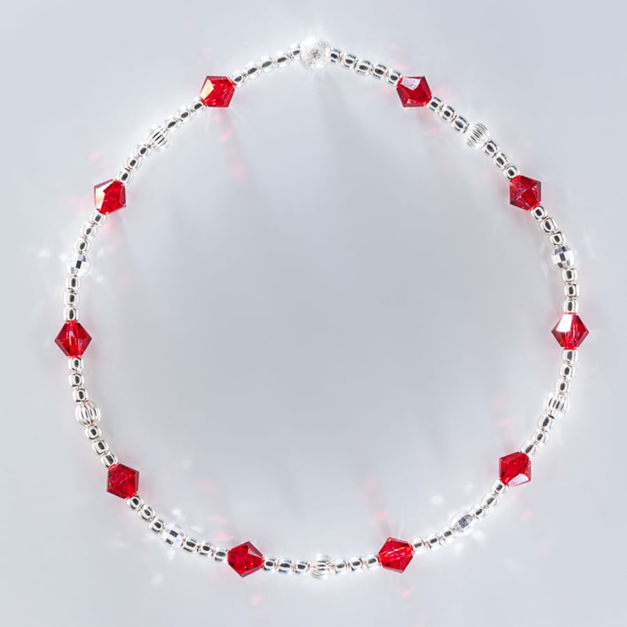 Dainty sterling silver bracelet with red Swarovski bicones