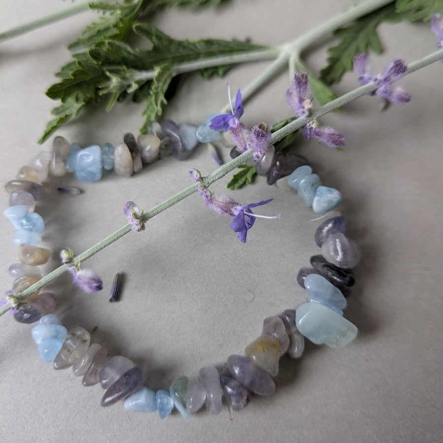 Clear communication bracelet with aquamarine and grey iolite