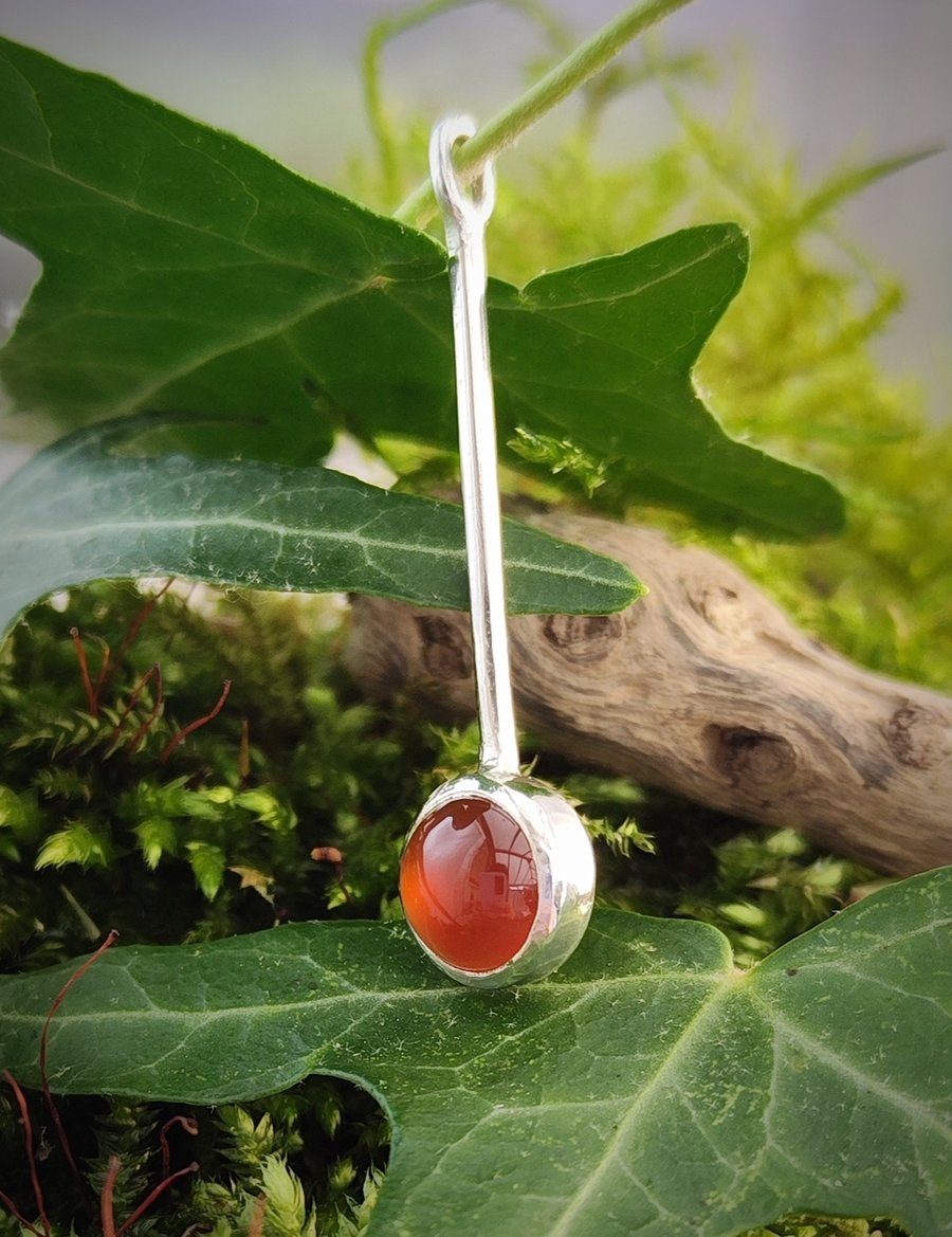 Sterling silver pendant with round carnelian cabochon