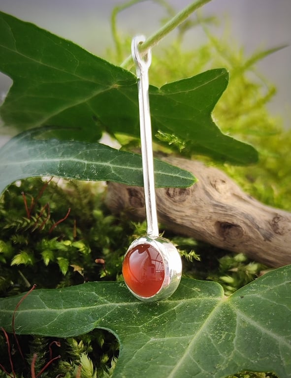 Sterling silver pendant with round carnelian cabochon