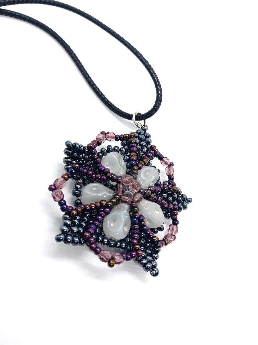 Beaded flower and skulls purple tones pendant necklace
