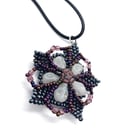 Beaded flower and skulls purple tones pendant necklace