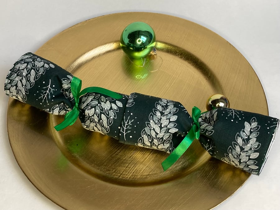 Pick and Mix Reusable Christmas Cracker. Dark green with snowy trees.