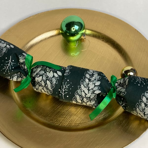 Pick and Mix Reusable Christmas Cracker. Dark green with snowy trees.
