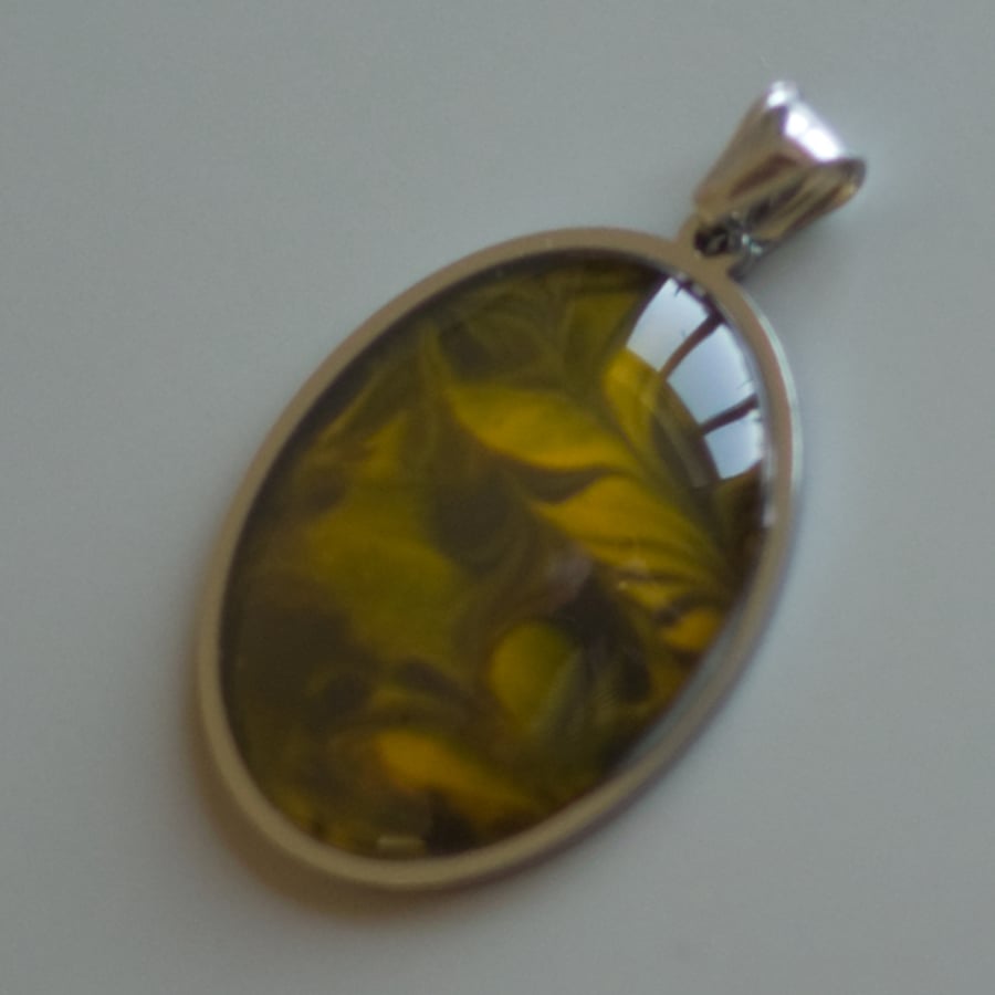 40mm x 30mm stainless steel pendant with glass cabochon.