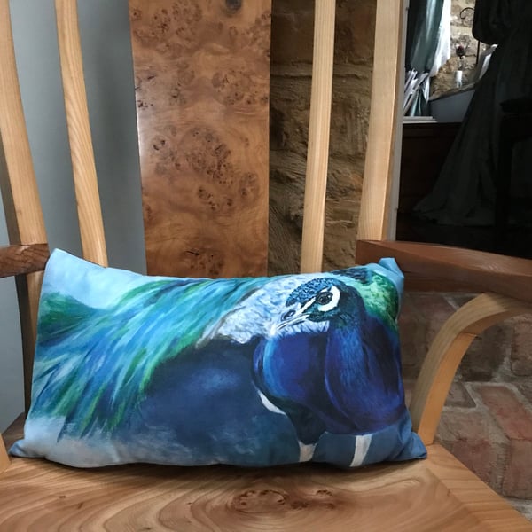 Gorgeous peacock cushion designed by British artist