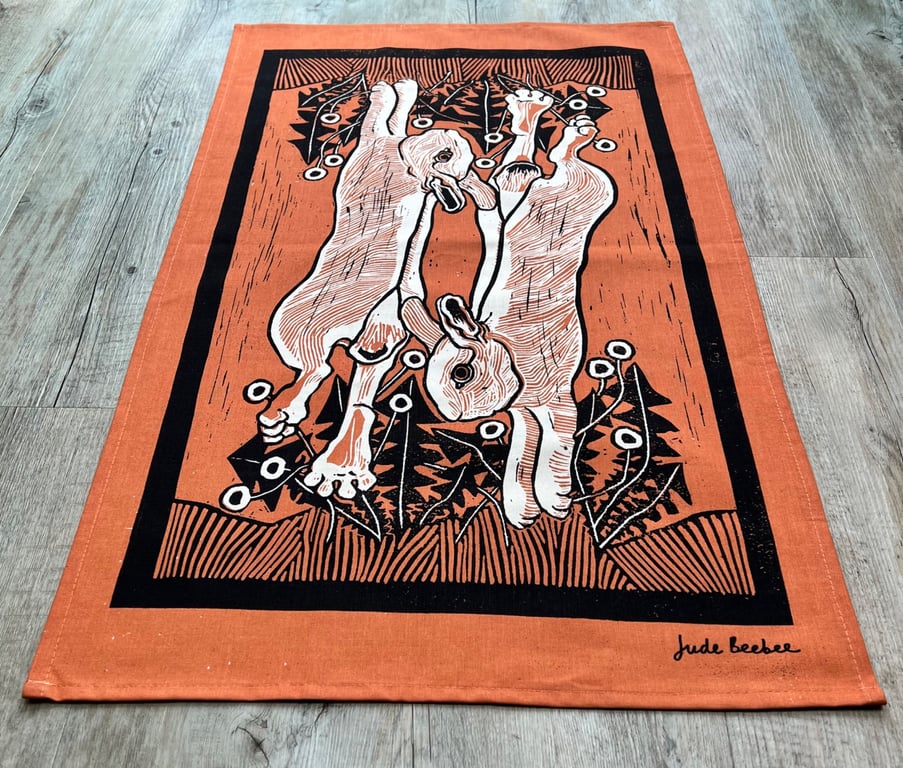 "Leap for Joy" tea towel - rabbit screen print in terracotta and black inks