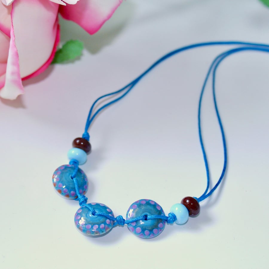 Blue lampwork glass disc and cord necklace