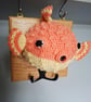 Crocheted puffer fish head on wooden board with hooks - Image 5