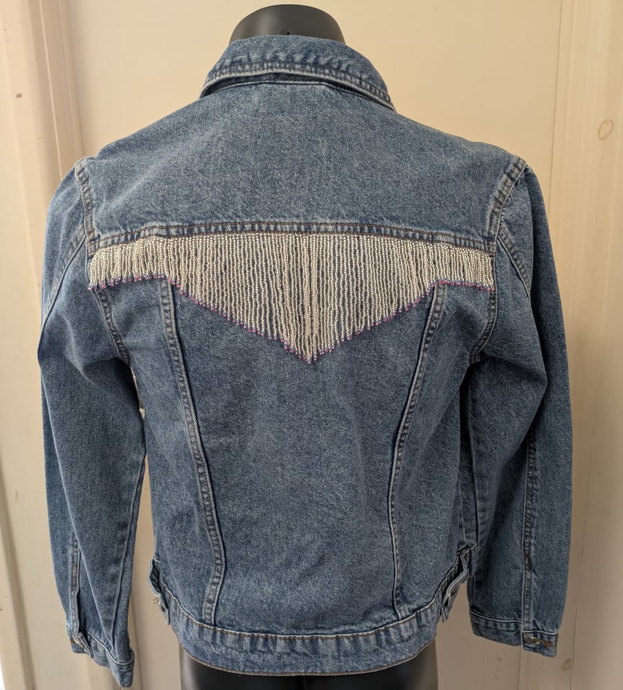 Up-cycled denim jacket with beaded fringe. Size 12.