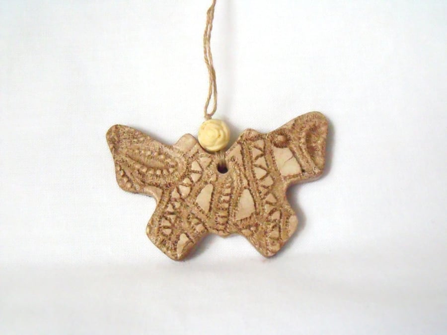 ceramic butterfly hanging decoration in beige