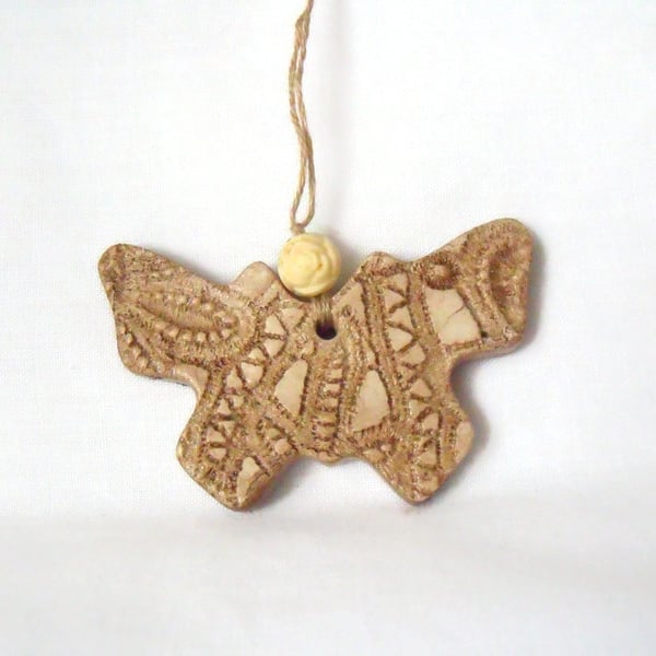 ceramic butterfly hanging decoration in beige