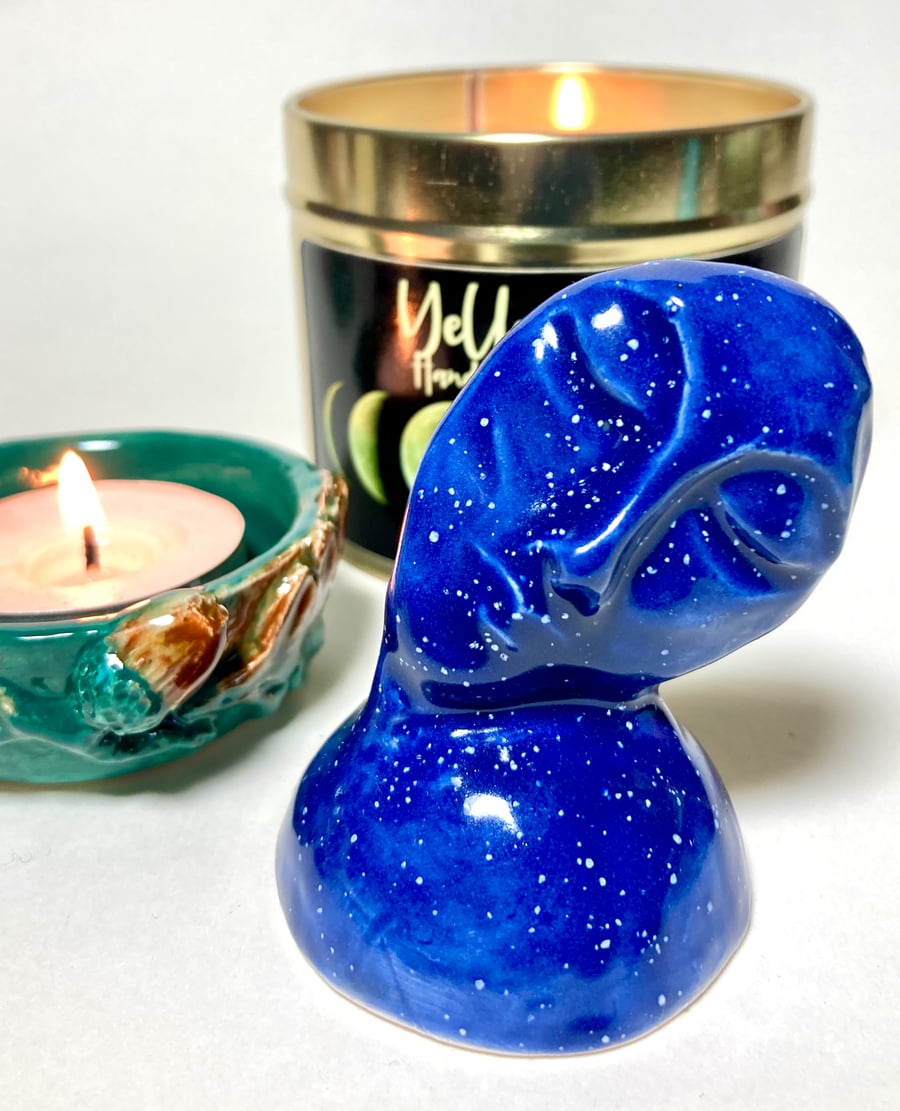 Resting face candle snuffer