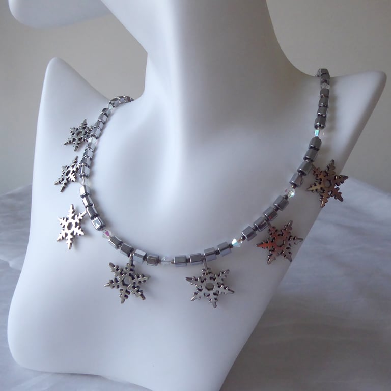 Cube and Faceted Bicone Beaded Necklace with Seven Dangling Metal Snowflakes  
