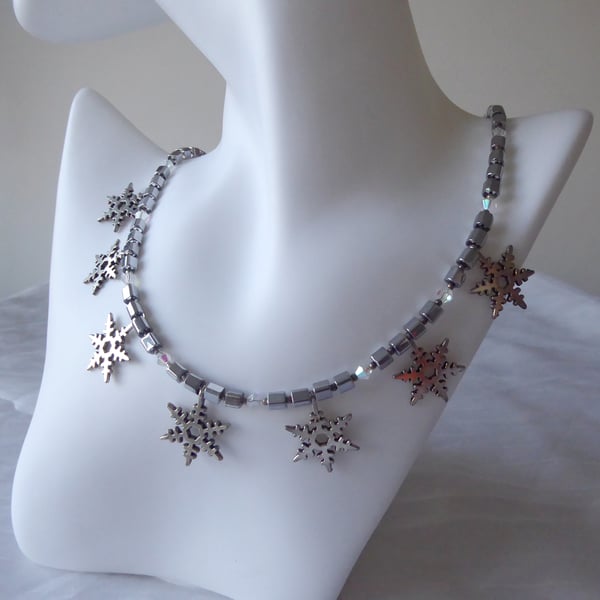 Cube and Faceted Bicone Beaded Necklace with Seven Dangling Metal Snowflakes  