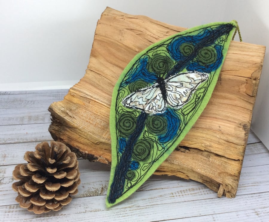 Embroidered leaf with butterfly home decoration. 