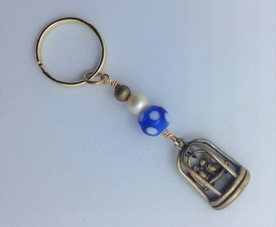 Key ring with a vintage pendant of lovebirds in a cage