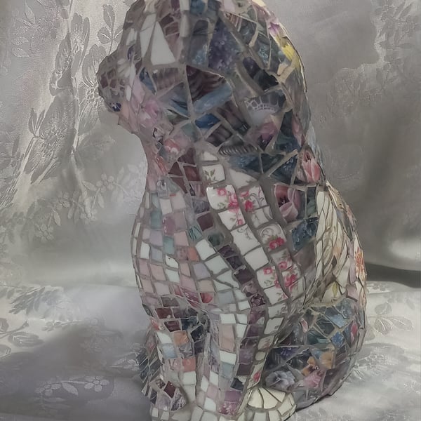 Mosaic-altered vintage ceramic cat figurine.