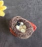 Needle felt Hedgehog on a leaf
