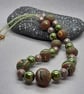 Polymer clay necklace in a brown swirl design with a hint of sparkle - Image 5