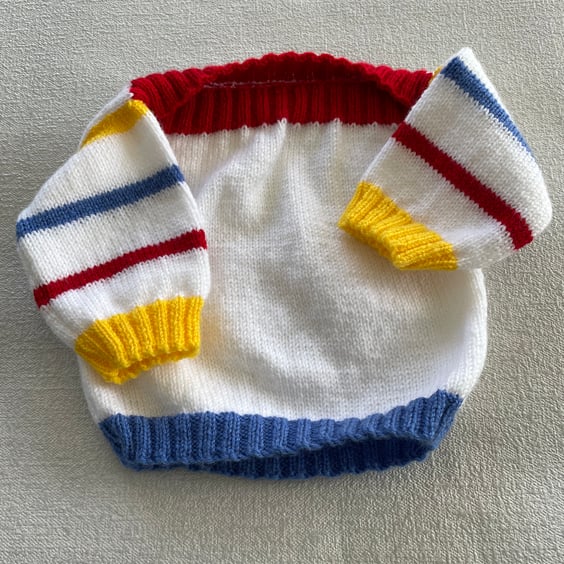 White jumper with bright stripes
