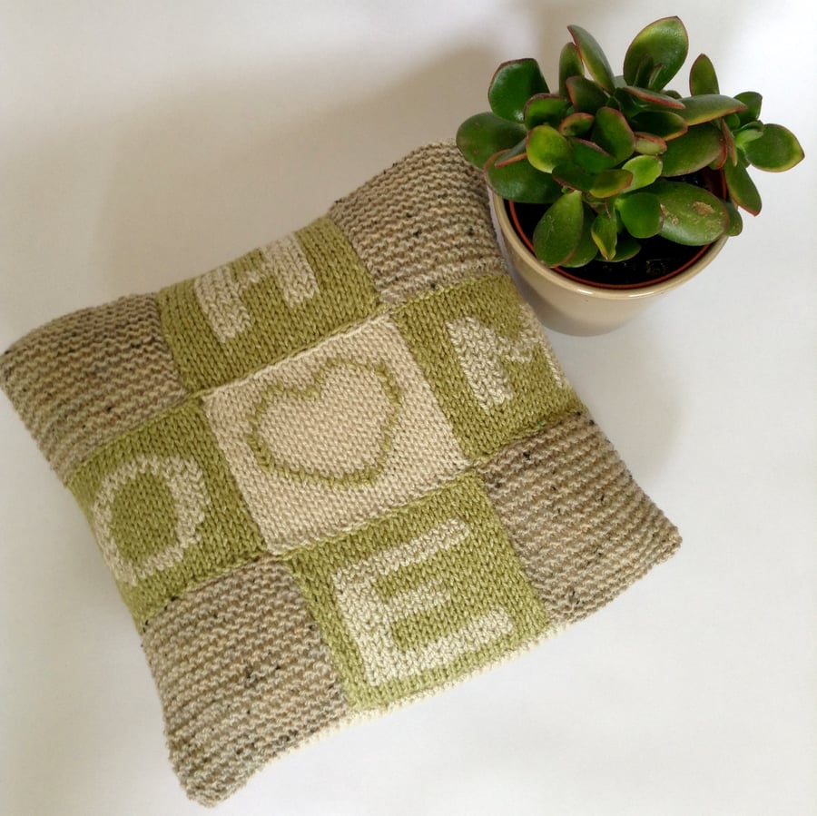 Small decorative hand-knitted cushion cover