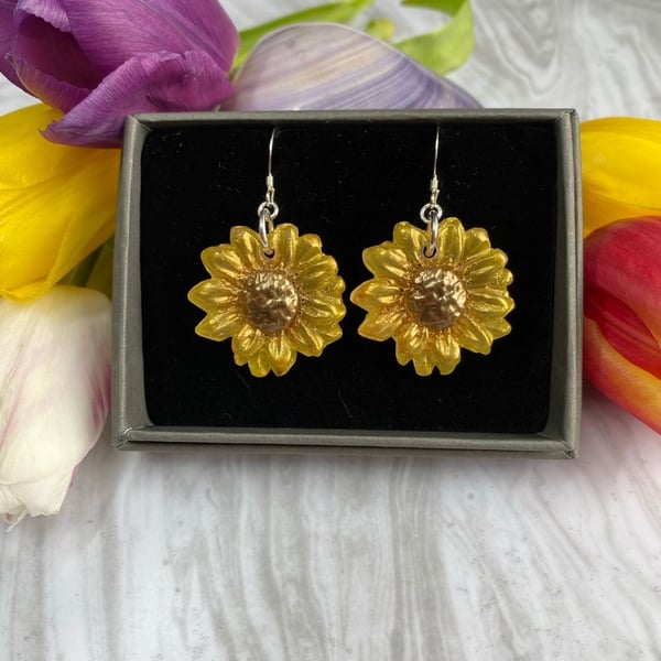 Sunflower resin earrings on sterling silver ear wires.