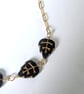 Gold filled chain necklace with black and gold Czech glass  leaf beads - Image 7