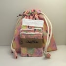 Butterfly printed cotton fabric wash bag and eye pads.