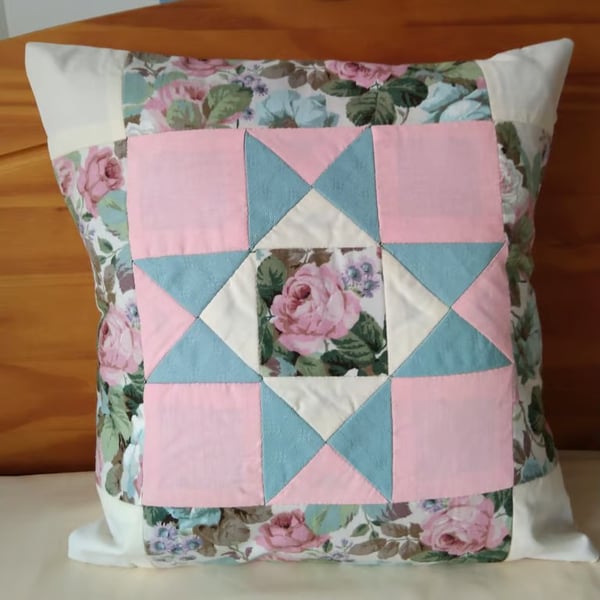 Patchwork cushion cover in pink, green and cream. Traditional hand stitched.