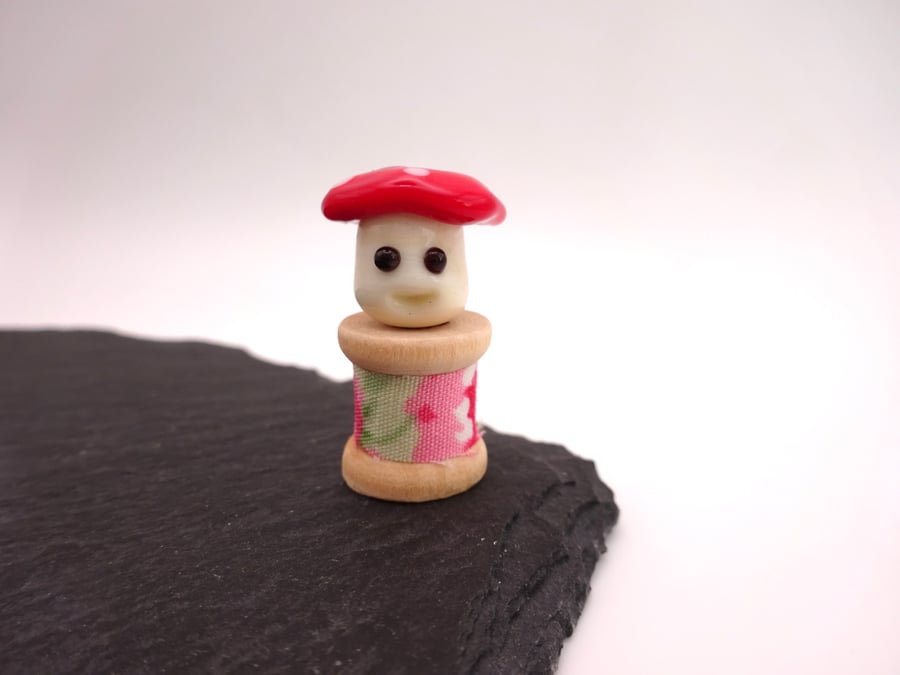 small glass toadstool bobbin