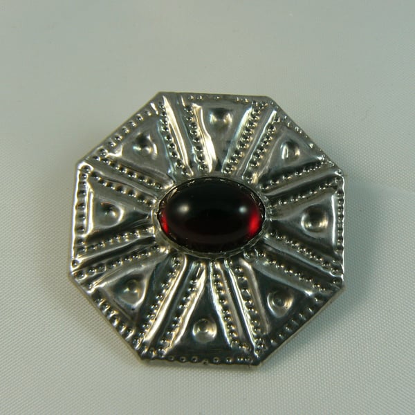 Pewter brooch with red stone