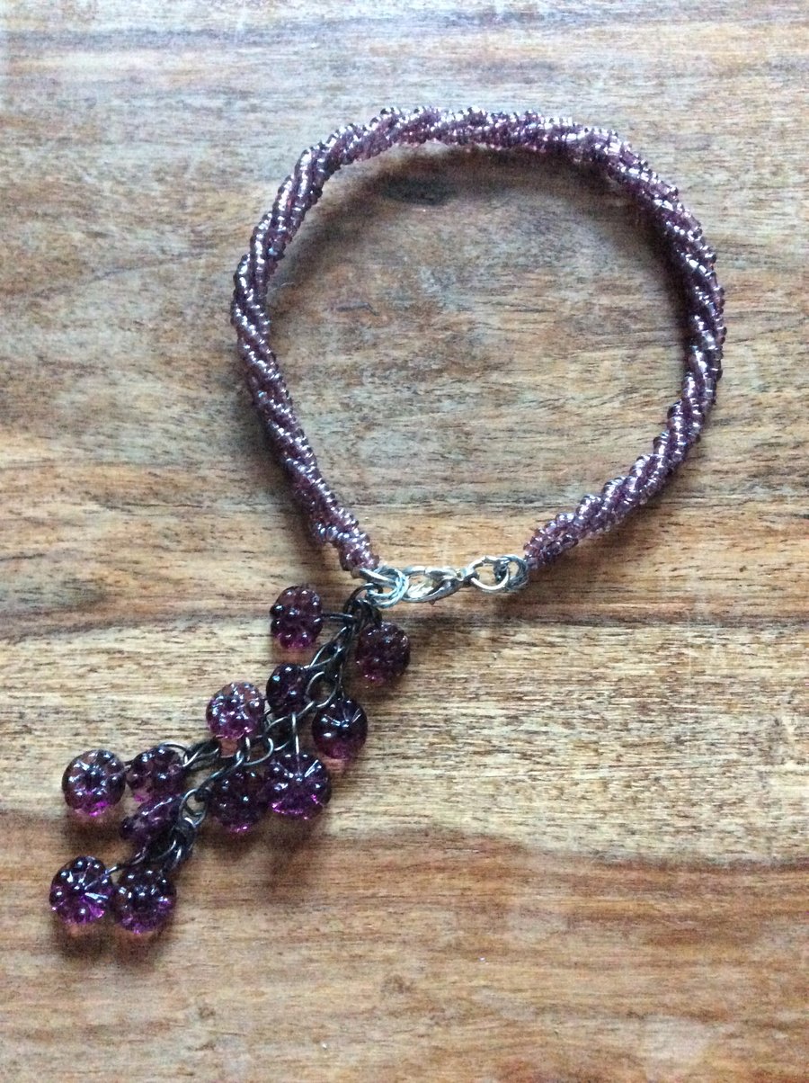 Beaded bracelet with flower charm 