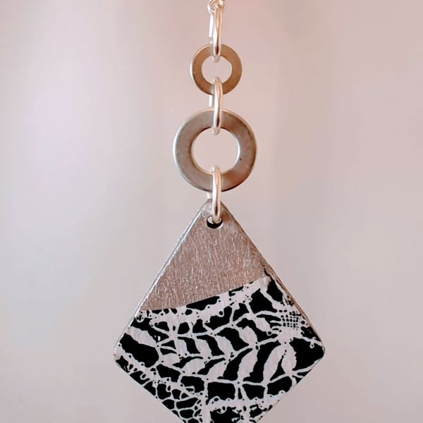 Geometric wood pendant on leather cord