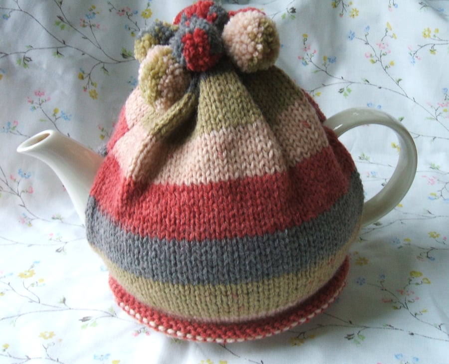 Hand knitted tea cosy - autumn colours with pom poms