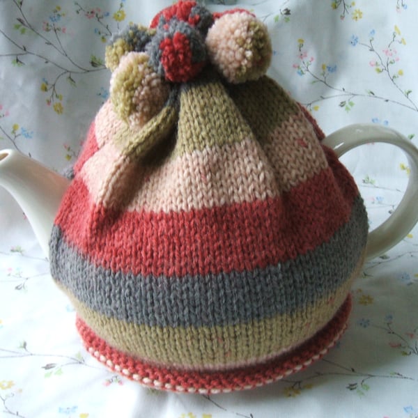 Hand knitted tea cosy - autumn colours with pom poms