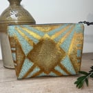 Copper gold and blue flat bottom zip pouch with ditsy floral lining 