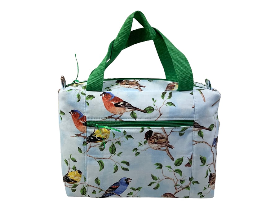Large wash bag in bird print, toiletries bag with handles and pocket.