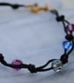 Swarovski crystal & black cord bracelet, blue, sapphire, purple, fuchsia - Image 2